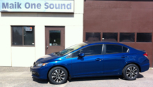 Blue 2013 Honda Civic with professional automotive window film